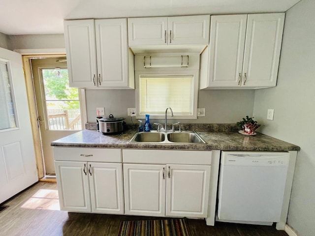 1206 N Walnut St, Plymouth, IN 46563 - kitchen with white dishwasher, a sink, dark wood-type flooring, white cabinetry, and dark countertops