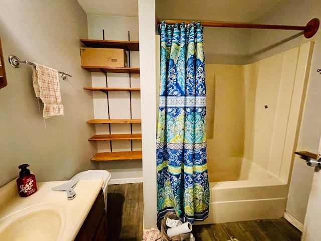 1206 N Walnut St, Plymouth, IN 46563 - full bathroom featuring wood finished floors, shower / bathtub combination with curtain, baseboards, and vanity