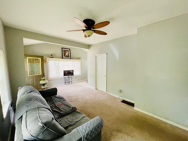 1206 N Walnut St, Plymouth, IN 46563 - carpeted living area featuring ceiling fan and baseboards