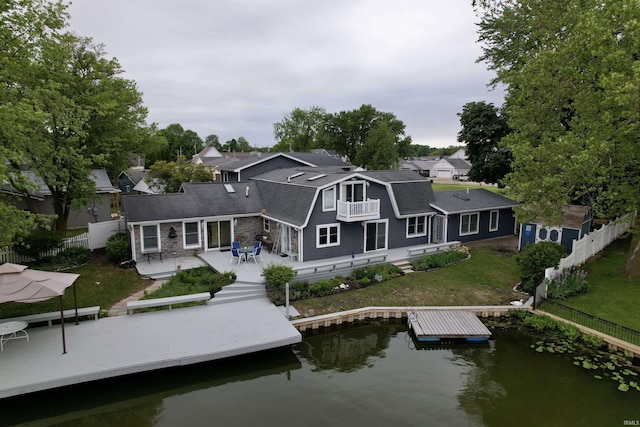2109 Ball Ct, Rochester, IN 46975 - rear view of property with a water view, a shingled roof, and a gambrel roof