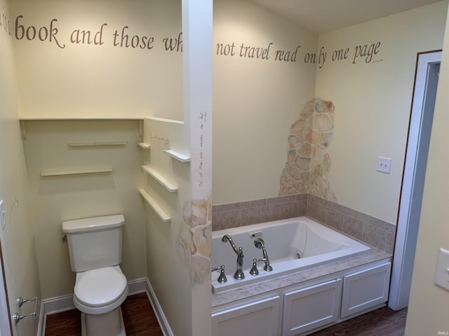 2109 Ball Ct, Rochester, IN 46975 - bathroom featuring a whirlpool tub, toilet, wood finished floors, and baseboards