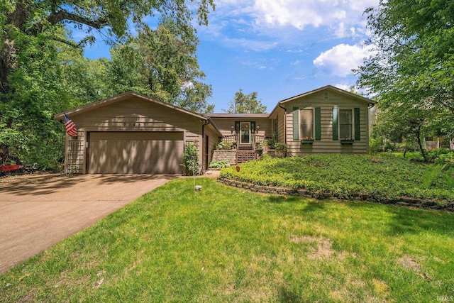 21485 Wallen Dr, South Bend, IN 46628 - view of front of house featuring an attached garage, driveway, and a front lawn