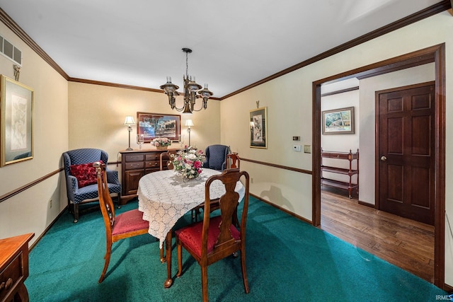 21485 Wallen Dr, South Bend, IN 46628 - carpeted dining area with a chandelier, ornamental molding, wood finished floors, and baseboards