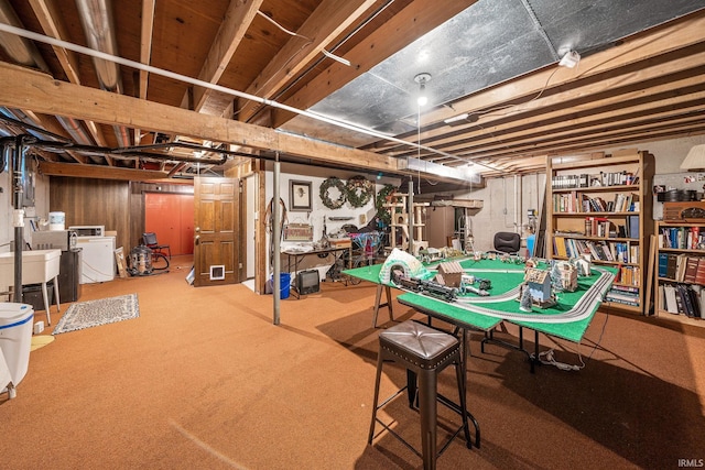21485 Wallen Dr, South Bend, IN 46628 - unfinished below grade area featuring washer and dryer and carpet flooring