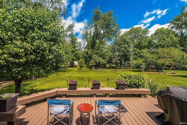 21485 Wallen Dr, South Bend, IN 46628 - deck featuring grilling area, a yard, and view of wooded area