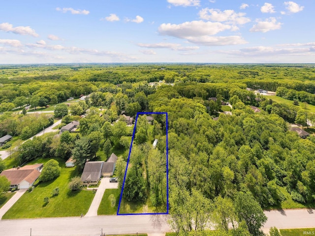 21485 Wallen Dr, South Bend, IN 46628 - aerial view of property and surrounding area featuring a heavily wooded area and property boundaries highlighted