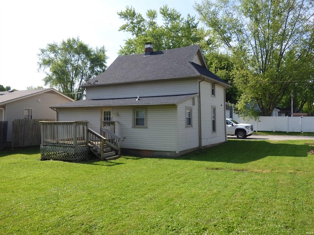 1200 E Ohio St, Frankfort, IN 46041 - rear view of property featuring a deck, roof with shingles, and a chimney