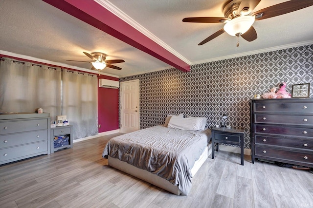 6447 W Delap Rd, Ellettsville, IN 47429 - bedroom featuring an AC wall unit, wood finished floors, crown molding, wallpapered walls, and a textured ceiling