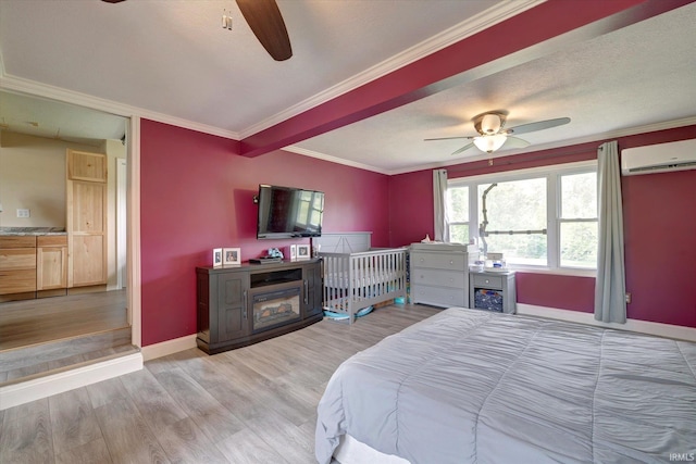 6447 W Delap Rd, Ellettsville, IN 47429 - bedroom with a wall mounted air conditioner, light wood finished floors, crown molding, baseboards, and ceiling fan