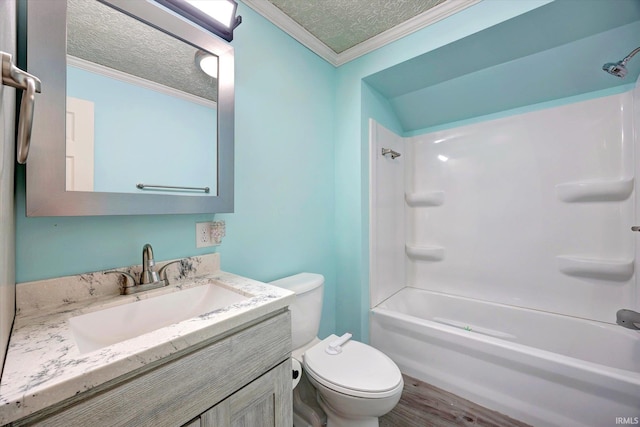 6447 W Delap Rd, Ellettsville, IN 47429 - bathroom with toilet, vanity, ornamental molding, a textured ceiling, and bathing tub / shower combination
