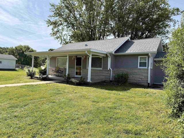 6447 W Delap Rd, Ellettsville, IN 47429 - ranch-style home featuring stone siding, covered porch, a shingled roof, and a front lawn