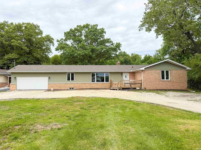 22073 County Road 10 W, Elkhart, IN 46514 - ranch-style home featuring brick siding, a front lawn, and an attached garage