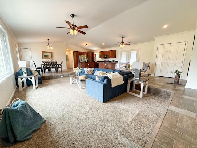 22073 County Road 10 W, Elkhart, IN 46514 - living room with ceiling fan, vaulted ceiling, baseboards, and ornamental molding