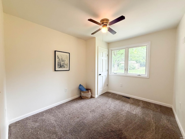 22073 County Road 10 W, Elkhart, IN 46514 - carpeted empty room with a ceiling fan and baseboards