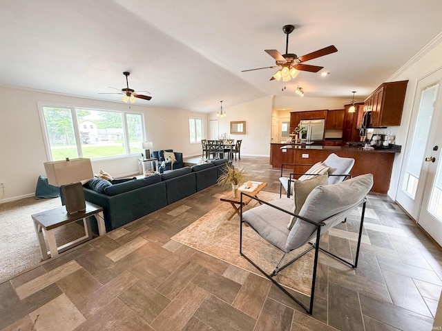 22073 County Road 10 W, Elkhart, IN 46514 - living room with a ceiling fan, vaulted ceiling, baseboards, and ornamental molding