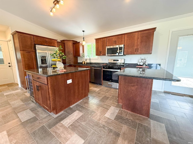 22073 County Road 10 W, Elkhart, IN 46514 - kitchen featuring appliances with stainless steel finishes, ornamental molding, lofted ceiling, a kitchen island, and a sink