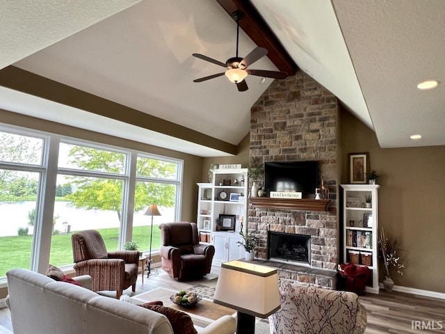 1442 Centerbrook Dr, New Haven, IN 46774 - living area with a fireplace, ceiling fan, wood finished floors, and baseboards
