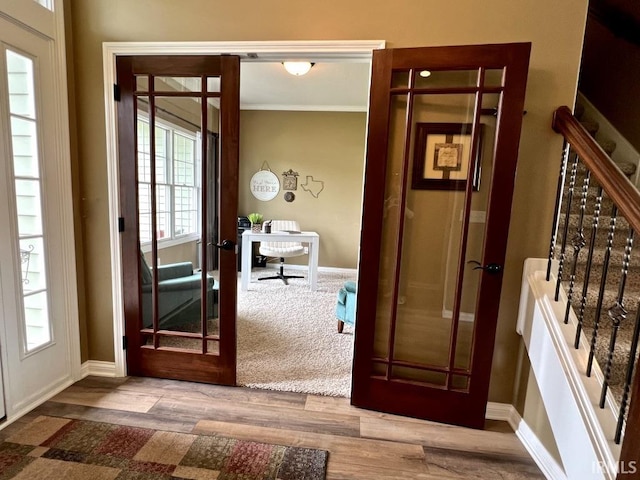 1442 Centerbrook Dr, New Haven, IN 46774 - foyer featuring stairway, wood finished floors, french doors, and crown molding
