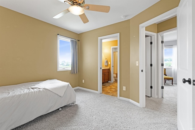 1442 Centerbrook Dr, New Haven, IN 46774 - bedroom featuring light carpet, baseboards, ceiling fan, and ensuite bath