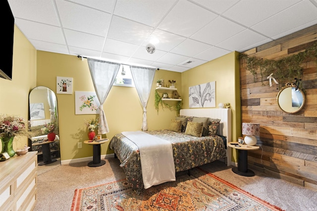 1442 Centerbrook Dr, New Haven, IN 46774 - carpeted bedroom featuring wood walls, a paneled ceiling, and baseboards