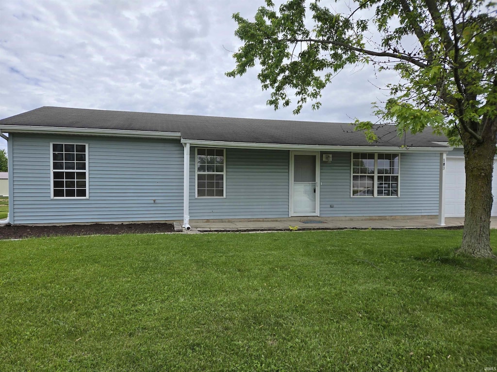 103 Adams Cts, Ashley, IN 46705 - ranch-style house featuring a front yard and a garage