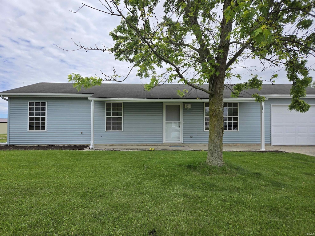 103 Adams Cts, Ashley, IN 46705 - view of front facade with a garage and a front yard