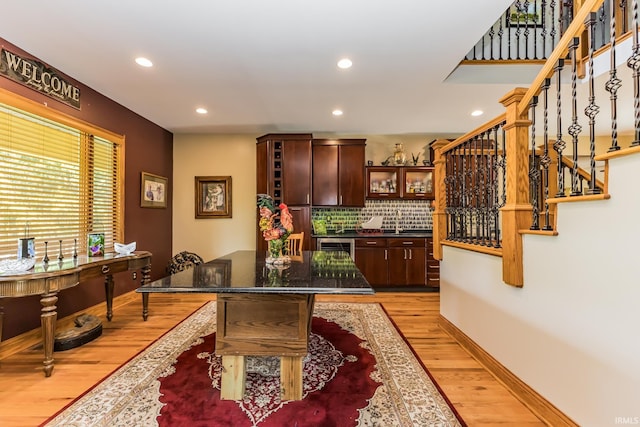501 W Fox Lake Rd, Angola, IN 46730 - bar area with light wood-style flooring, recessed lighting, tasteful backsplash, stairway, and beverage cooler