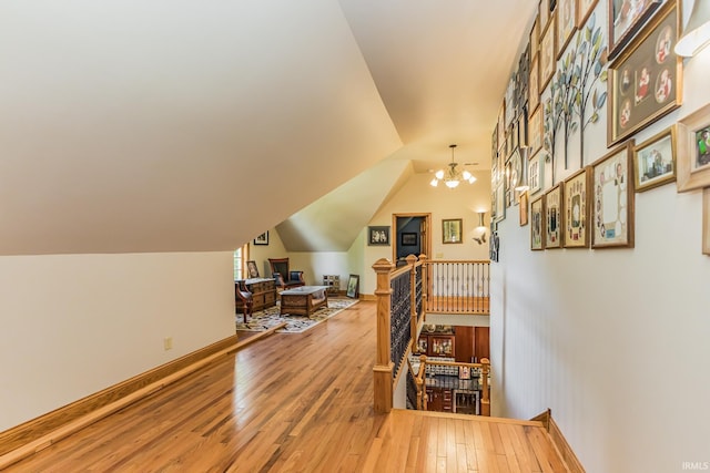 501 W Fox Lake Rd, Angola, IN 46730 - home office featuring wood finished floors, a chandelier, and baseboards