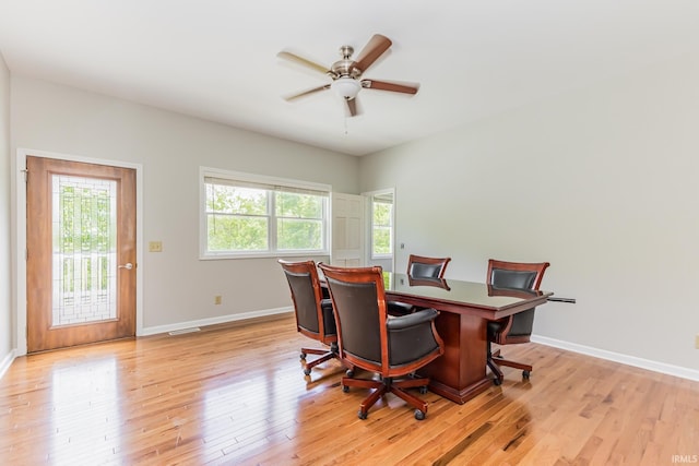 501 W Fox Lake Rd, Angola, IN 46730 - dining area featuring light wood-type flooring, baseboards, and a ceiling fan
