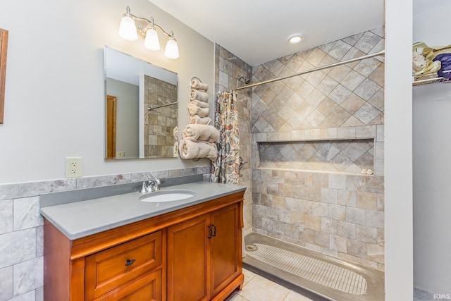 501 W Fox Lake Rd, Angola, IN 46730 - bathroom with vanity, tile patterned floors, and a tile shower