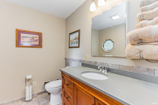 501 W Fox Lake Rd, Angola, IN 46730 - bathroom with toilet, vanity, and tile patterned flooring