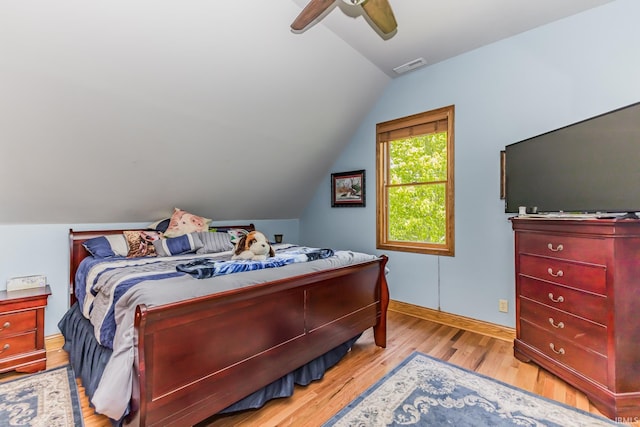 501 W Fox Lake Rd, Angola, IN 46730 - bedroom featuring lofted ceiling, wood finished floors, baseboards, and a ceiling fan