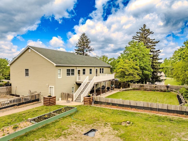 501 W Fox Lake Rd, Angola, IN 46730 - rear view of house featuring stairway, a wooden deck, and a shingled roof
