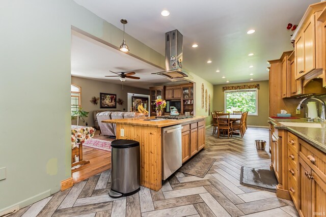501 W Fox Lake Rd, Angola, IN 46730 - kitchen featuring dishwasher, open floor plan, a sink, ceiling fan, and island exhaust hood