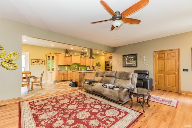 501 W Fox Lake Rd, Angola, IN 46730 - living room featuring ceiling fan, light wood-type flooring, baseboards, and recessed lighting