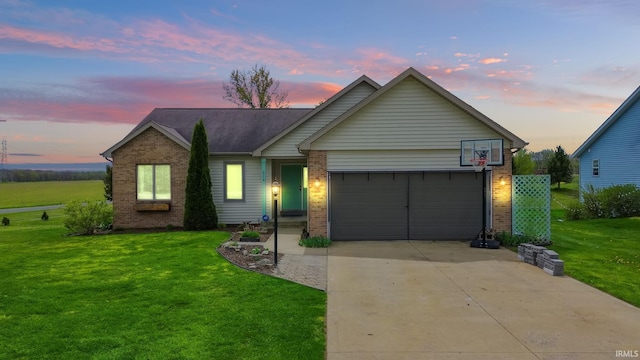 612 E Dunn Rd, New Carlisle, IN 46552 - single story home with brick siding, a yard, an attached garage, and driveway
