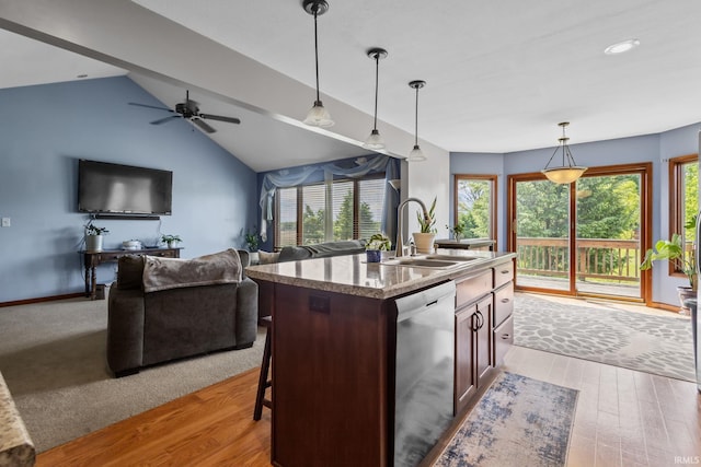 612 E Dunn Rd, New Carlisle, IN 46552 - kitchen with stainless steel dishwasher, a sink, healthy amount of natural light, pendant lighting, and lofted ceiling