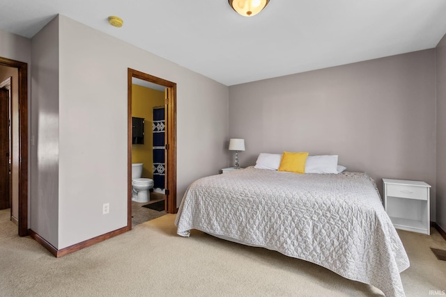 612 E Dunn Rd, New Carlisle, IN 46552 - carpeted bedroom featuring baseboards and connected bathroom