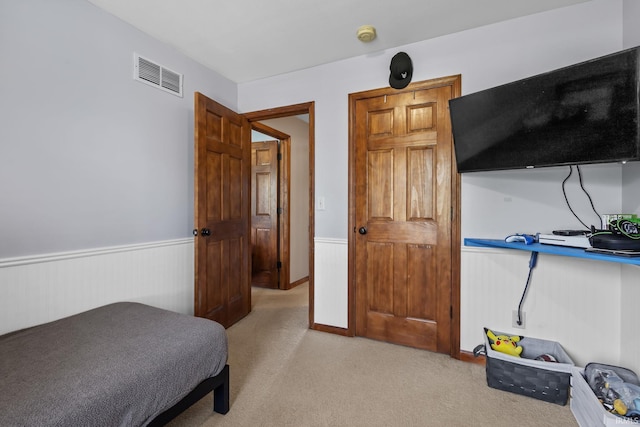 612 E Dunn Rd, New Carlisle, IN 46552 - bedroom with wainscoting and light colored carpet
