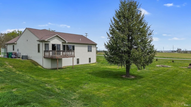 612 E Dunn Rd, New Carlisle, IN 46552 - rear view of house with a yard and central AC