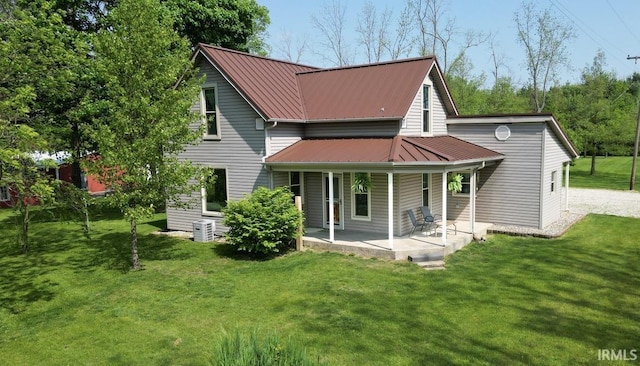 5480 S 950 W, South Whitley, IN 46787 - rear view of property featuring a lawn, metal roof, and a porch