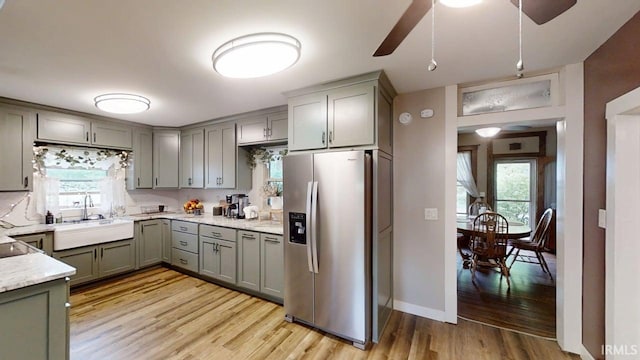 5480 S 950 W, South Whitley, IN 46787 - kitchen featuring stainless steel fridge with ice dispenser, a sink, ceiling fan, gray cabinets, and light wood-style floors