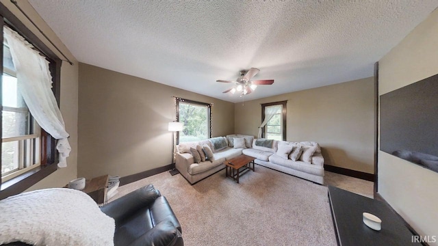 5480 S 950 W, South Whitley, IN 46787 - living area with a ceiling fan, carpet floors, baseboards, and a textured ceiling