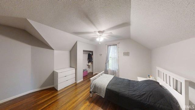 5480 S 950 W, South Whitley, IN 46787 - bedroom with wood finished floors, vaulted ceiling, baseboards, a ceiling fan, and a textured ceiling