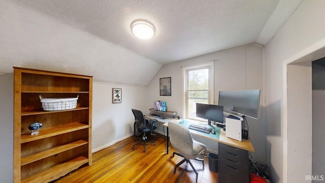 5480 S 950 W, South Whitley, IN 46787 - office area featuring vaulted ceiling, wood finished floors, a textured ceiling, and baseboards