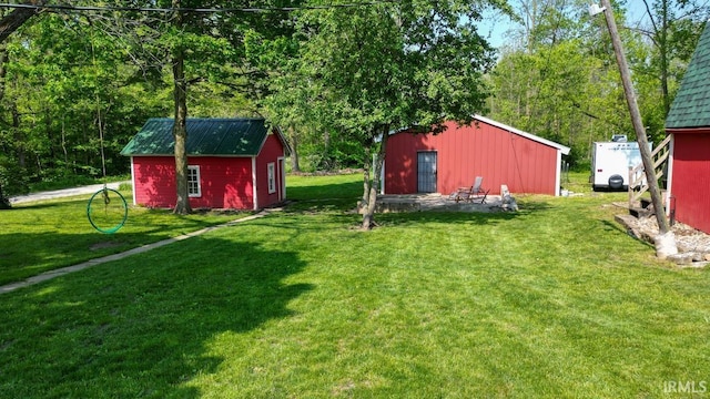 5480 S 950 W, South Whitley, IN 46787 - view of green lawn with an outbuilding