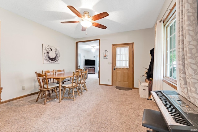 517 N Nancy St, Warren, IN 46792 - dining room featuring carpet, a ceiling fan, and baseboards
