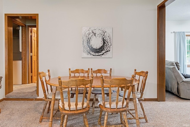 517 N Nancy St, Warren, IN 46792 - dining area with carpet floors and baseboards