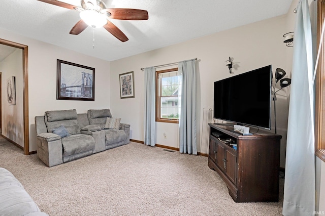 517 N Nancy St, Warren, IN 46792 - living room with a ceiling fan, light colored carpet, and baseboards