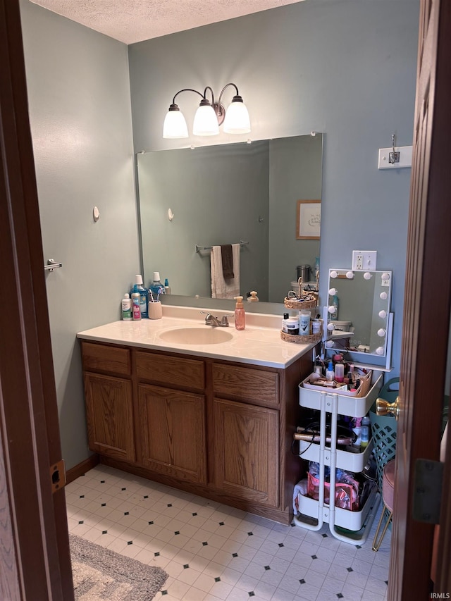 311 Hampshire Dr, Logansport, IN 46947 - bathroom with vanity and a textured ceiling